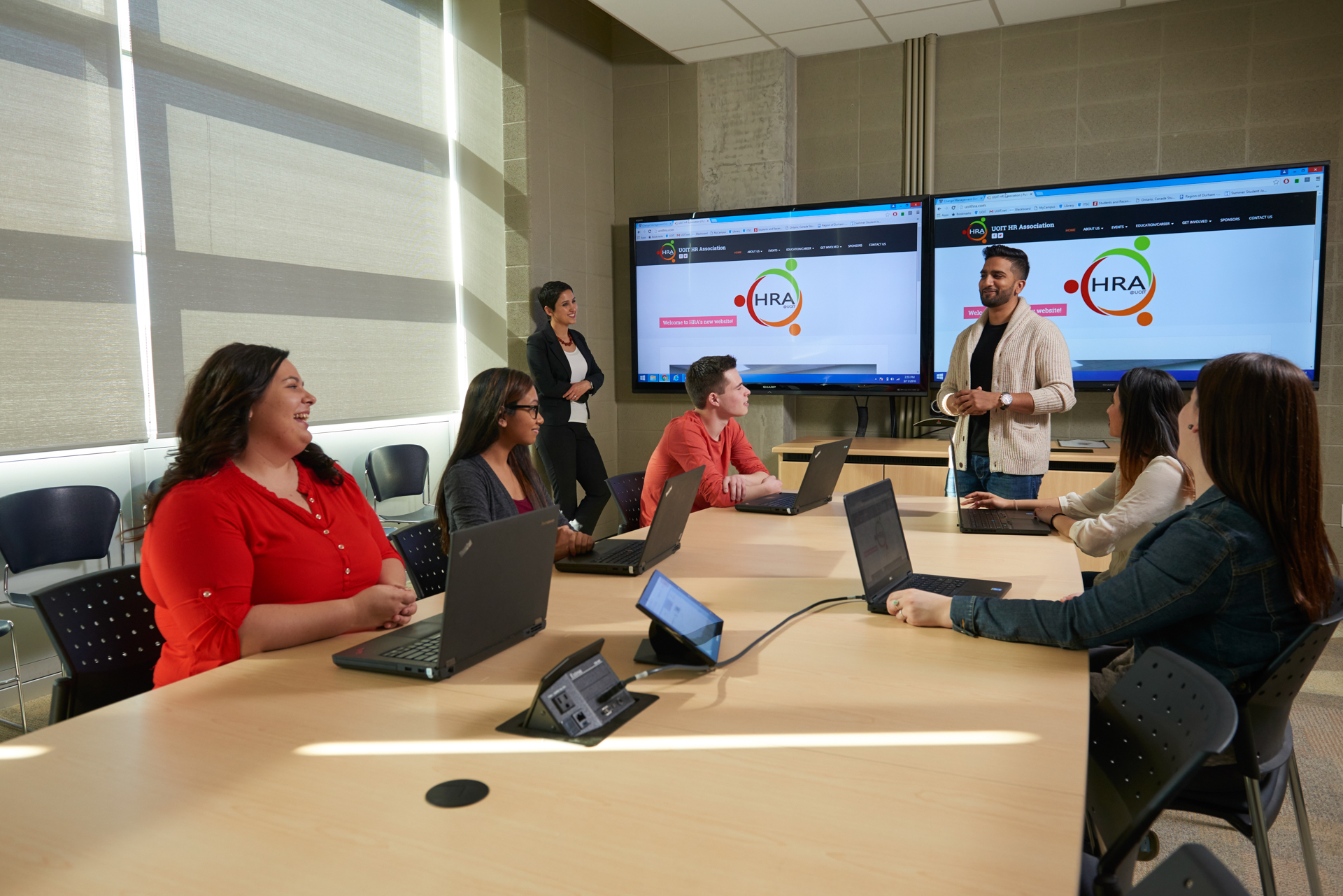 Professor and student examining data