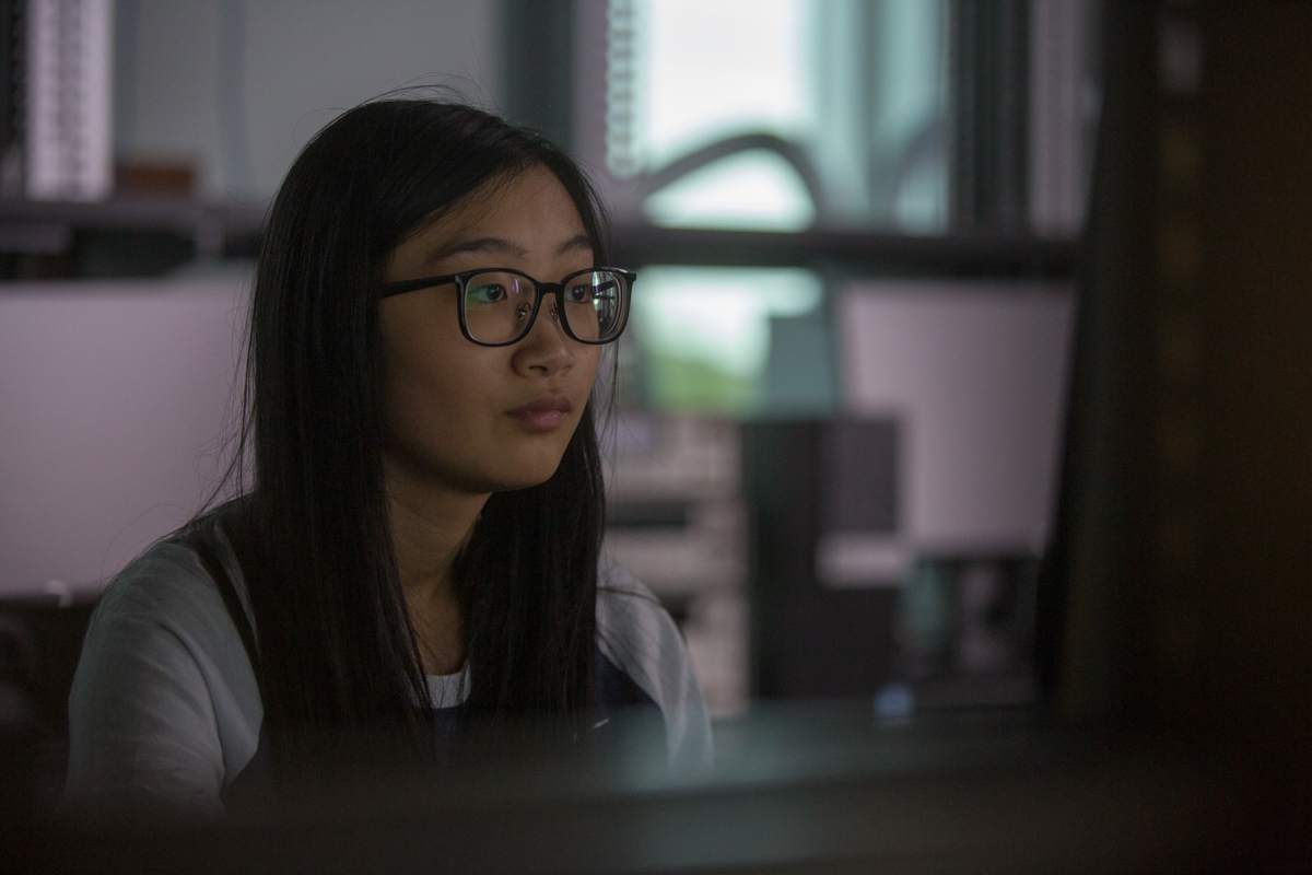 student in lab with equipment
