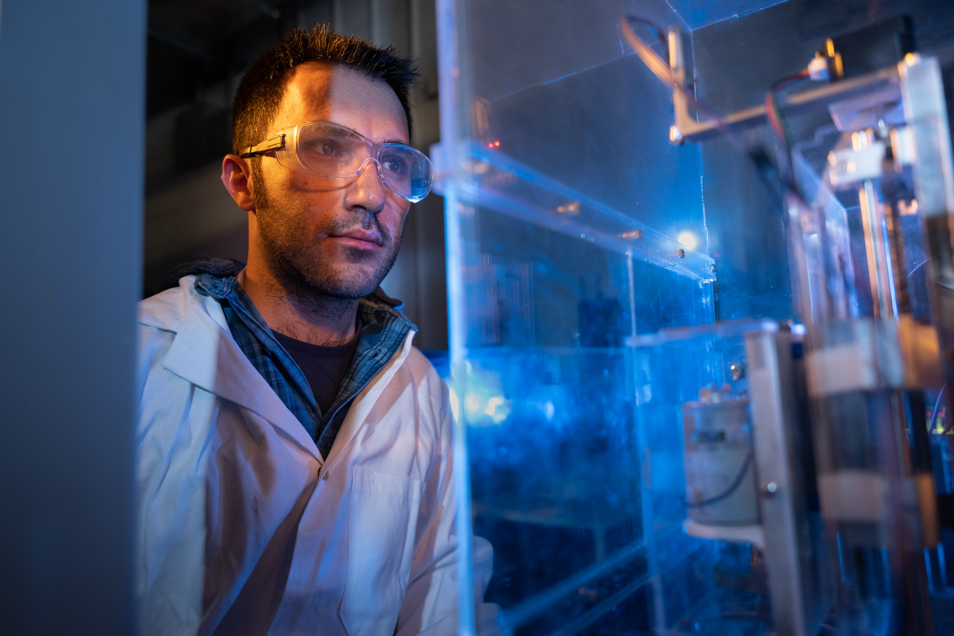 Student wearing safety goggles in a lab