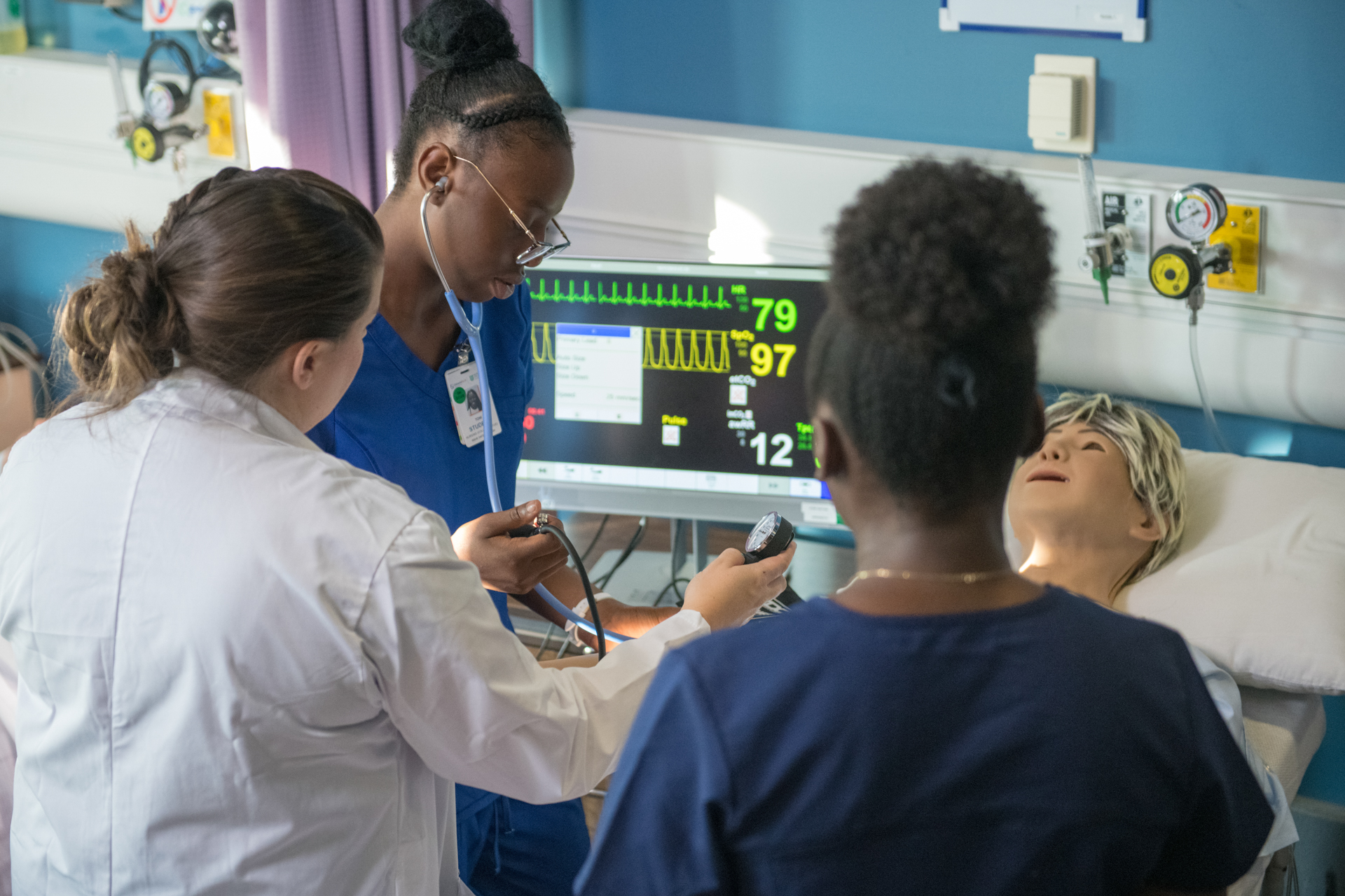 Nursing students in a clinical environment.
