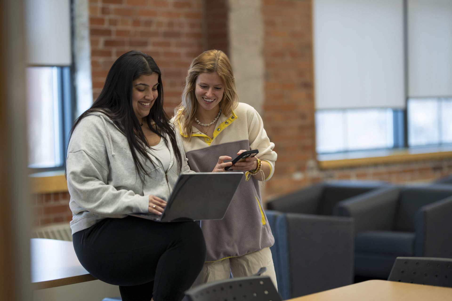 Professor and student examining data