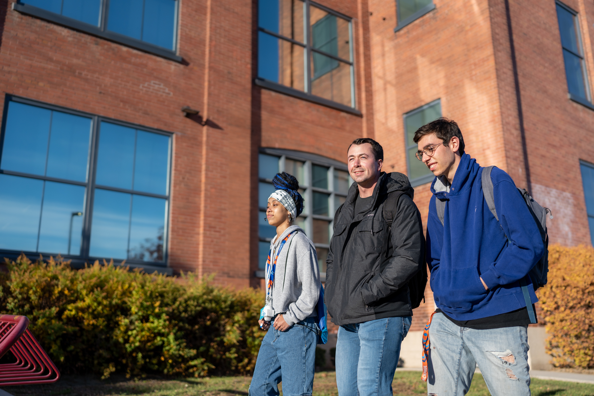 Students walking outside building.