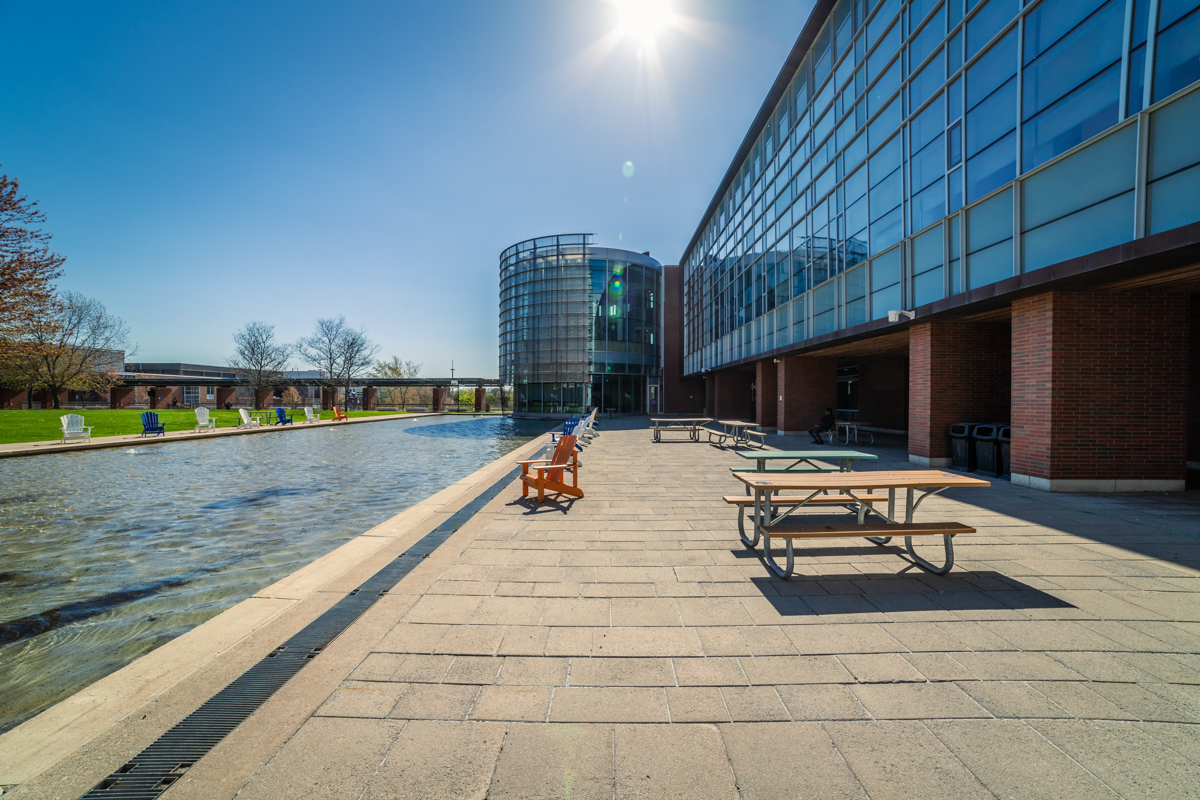 buildings image showing lib, library, exterior, water, glass, window, lawn chairs, tree, grass at library