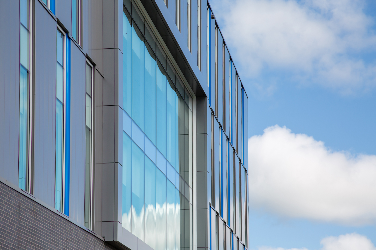 Glass building with clouds