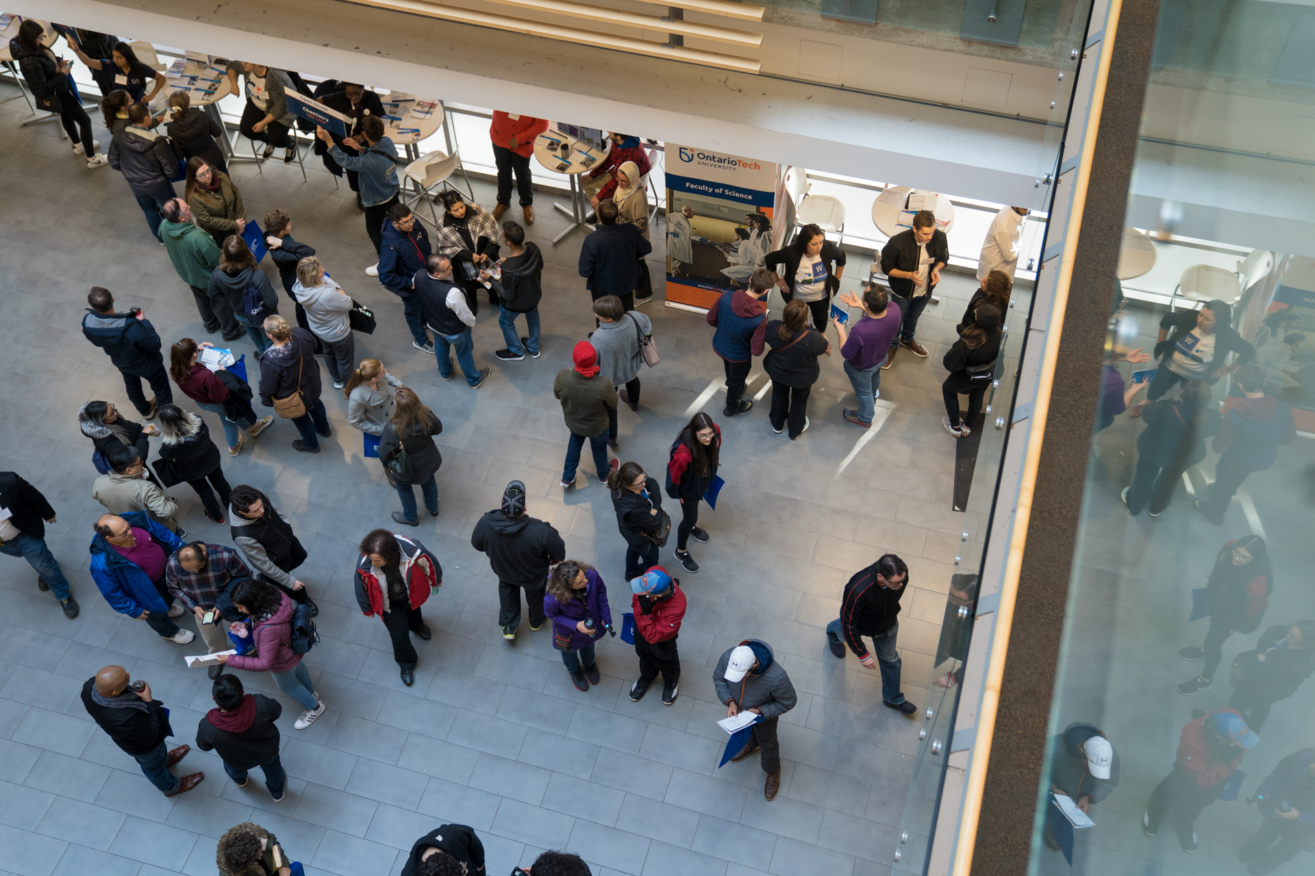 A crowd of people in an atrium.