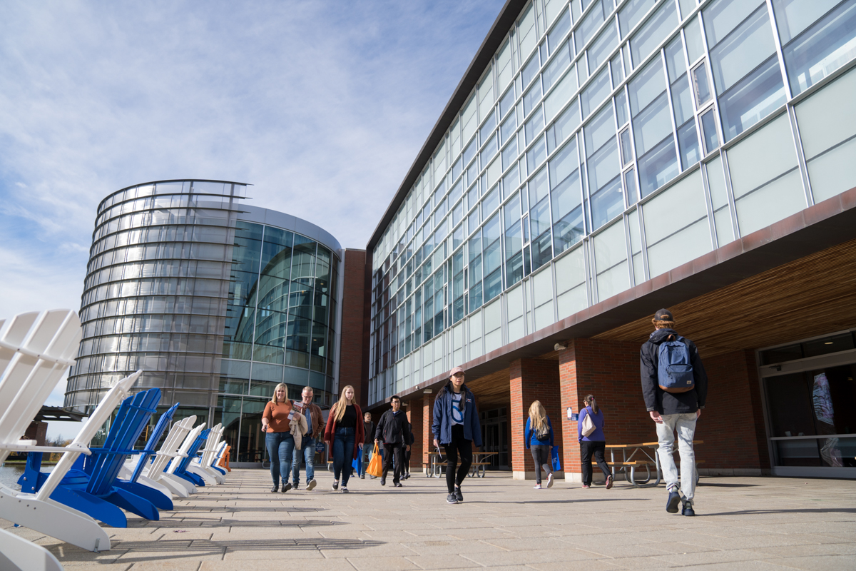 events image showing exterior, lib, library, glass, students, walking, lawn chairs at library