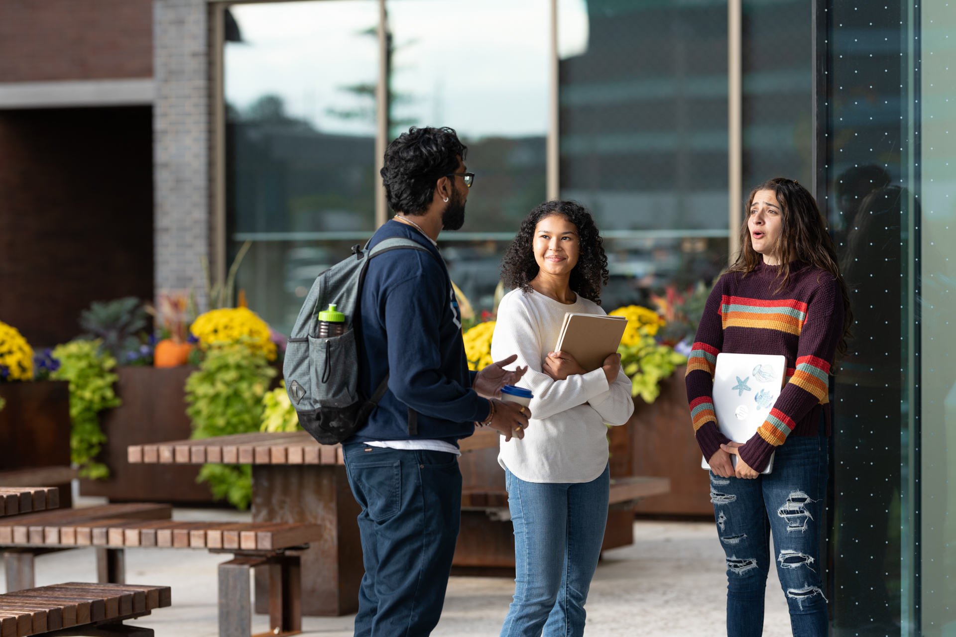 Students talking outside a building