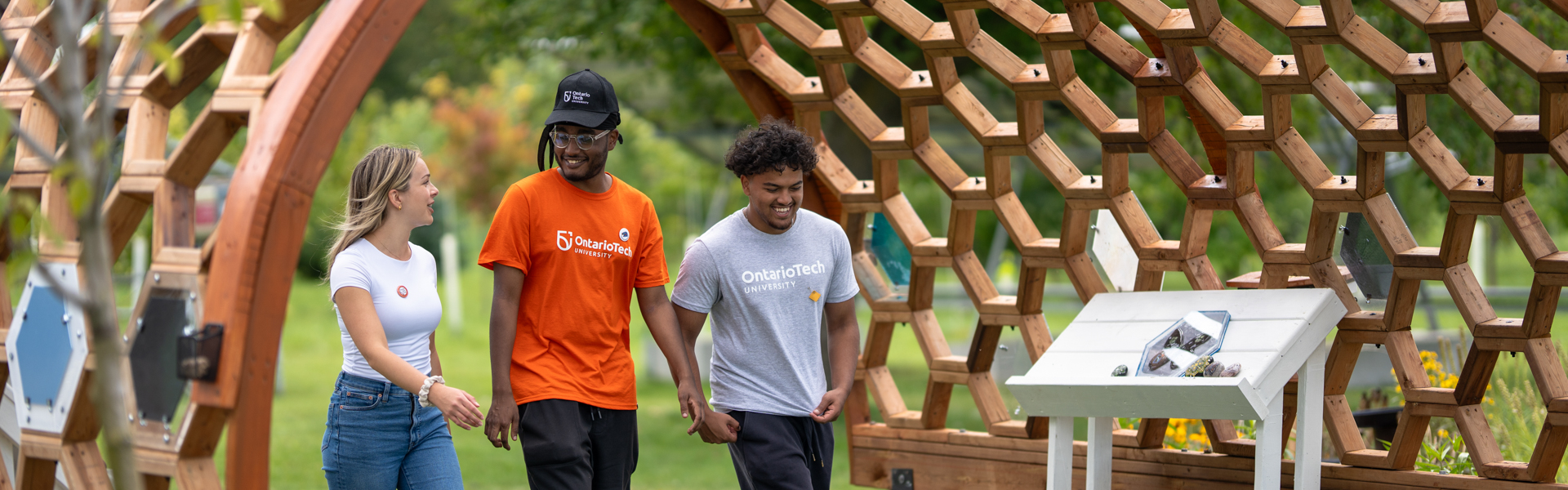three students walking in campus